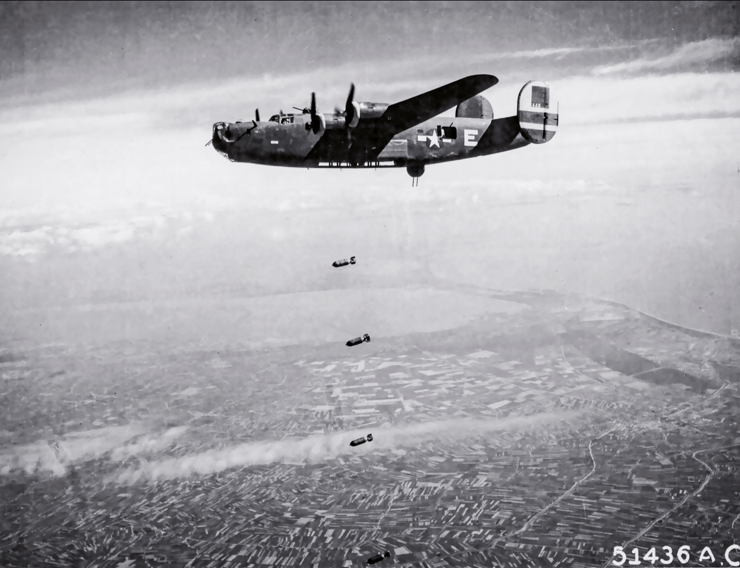 B-24D 'Gum Drop' / 'Patches', 783rd Bomb Squadron, over rail yards at Forl&igrave;, Italy, 19 May 1944
